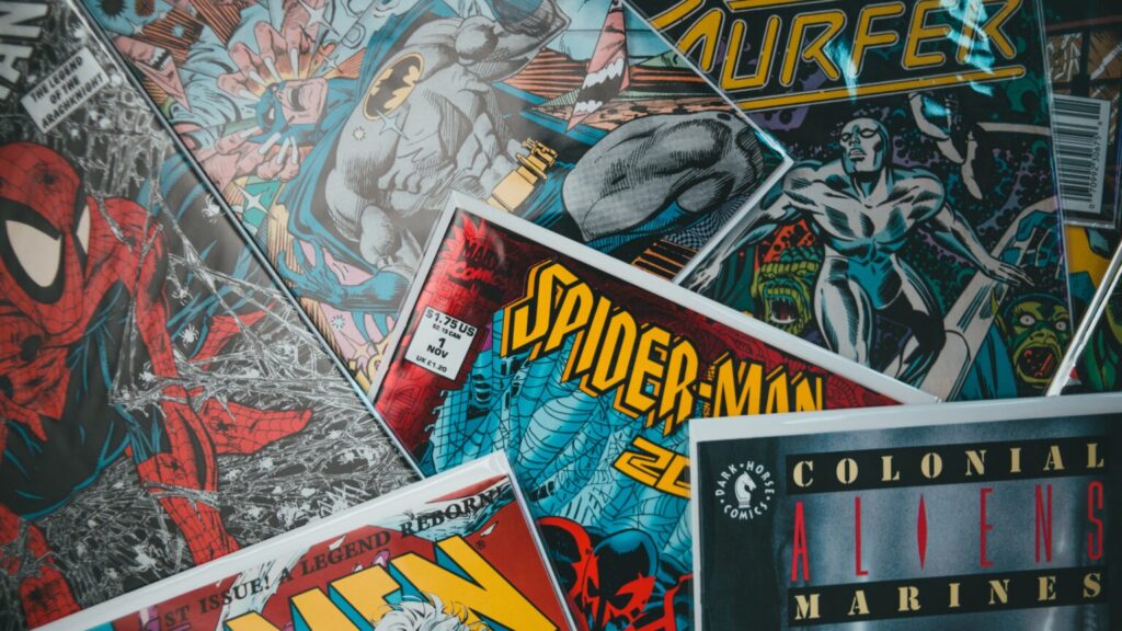 Comic books sprawled out across a table
