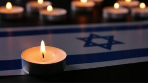The flag of Israel with a candle