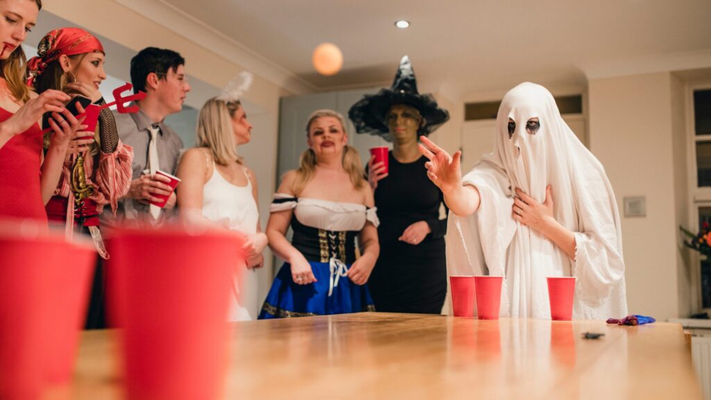 A group of young people playing a game together. They are are dressed up in different costumes