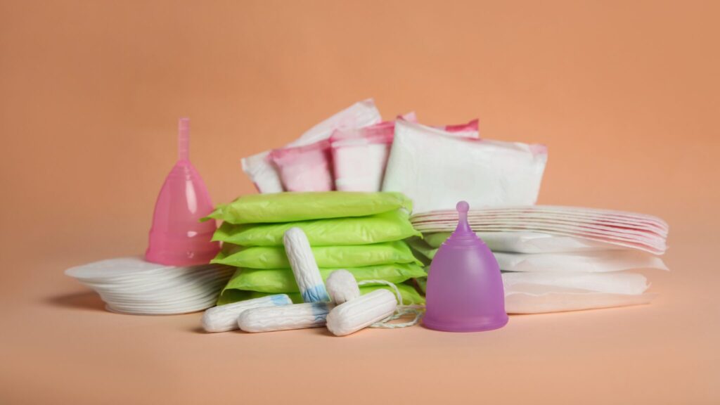 A big pile of menstrual products on a table.