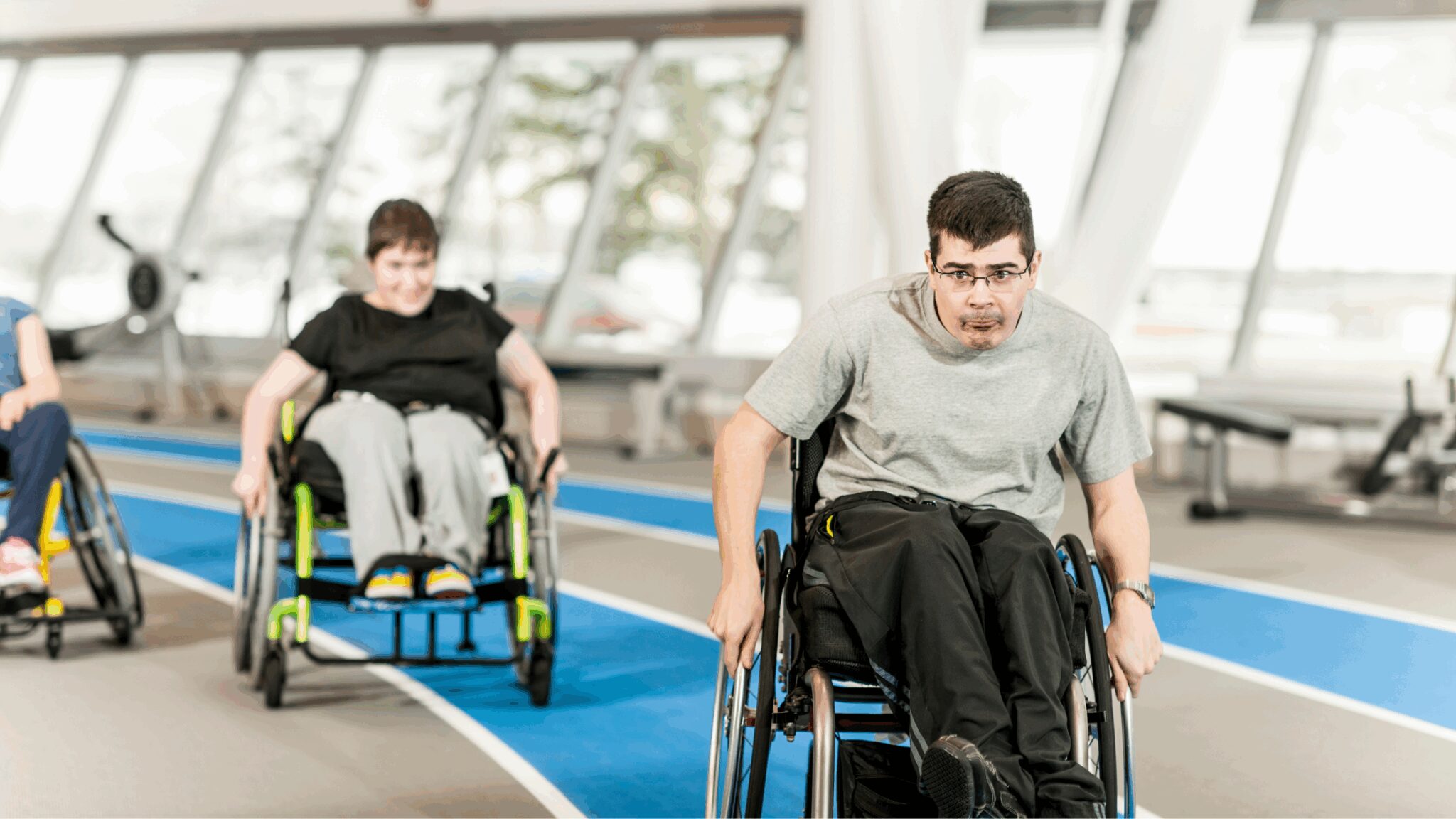Young people taking part in a wheelchair race