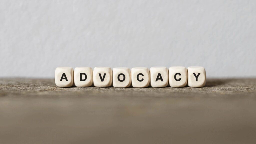 The word advocacy spelt out with beads