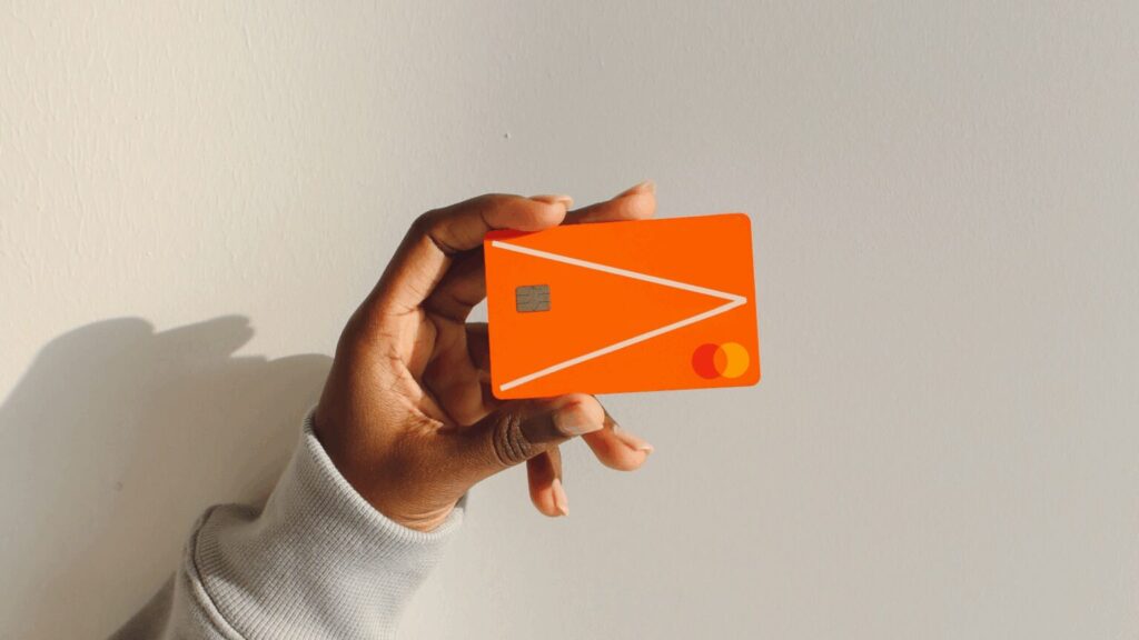 Person holding a debit card