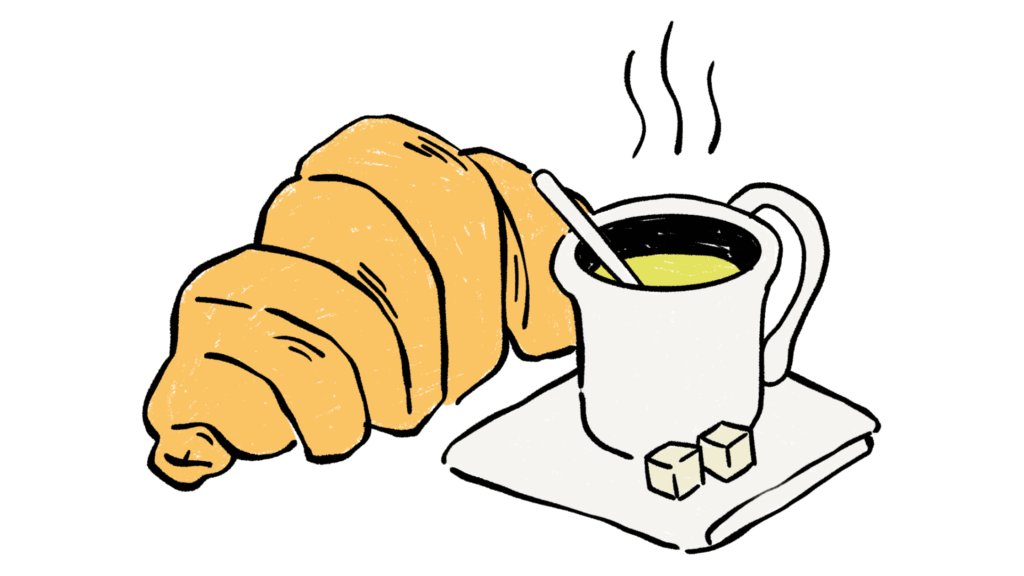 Croissant and a hot drink with 2 sugar cubes