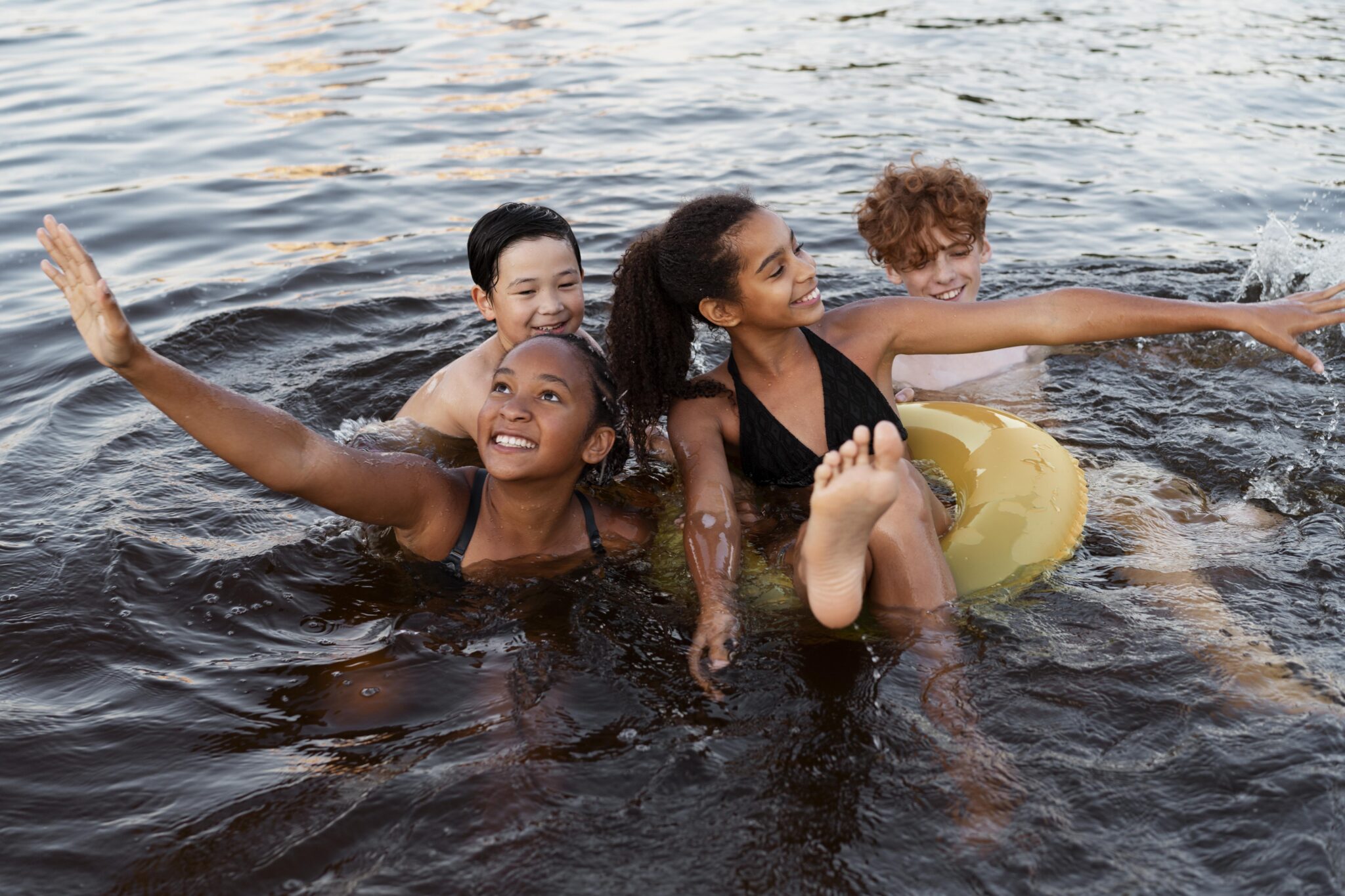 Four people swimming in the sea